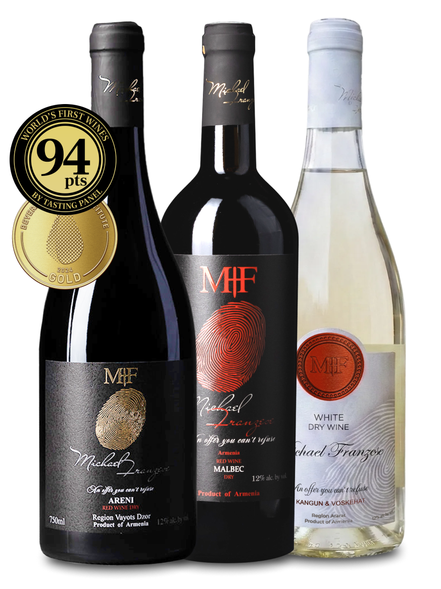 Three wine bottles with labels and a gold medal on a white background