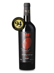 Wine bottle with a label and a gold medal on a white background