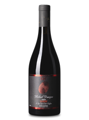Wine bottle with a dark label on a white background